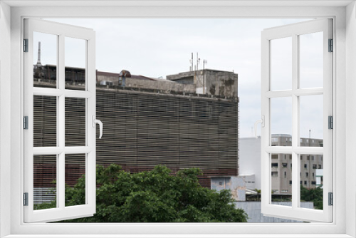Fototapeta Naklejka Na Ścianę Okno 3D - Abandoned Dull Buildings: A Haunting Look at Urban Decay