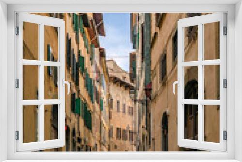 Fototapeta Naklejka Na Ścianę Okno 3D - Gothic buildings on a narrow street in Centro Storico of Florence, Italy