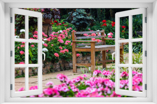 Fototapeta Naklejka Na Ścianę Okno 3D - A wooden bench in beautiful garden.