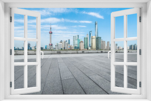 Fototapeta Naklejka Na Ścianę Okno 3D - Empty brick floor with modern building in Shanghai