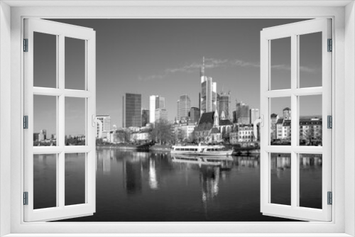 Fototapeta Naklejka Na Ścianę Okno 3D - scenic view to skyline of Frankfurt am Main with reflection of the skyline in river Main.
