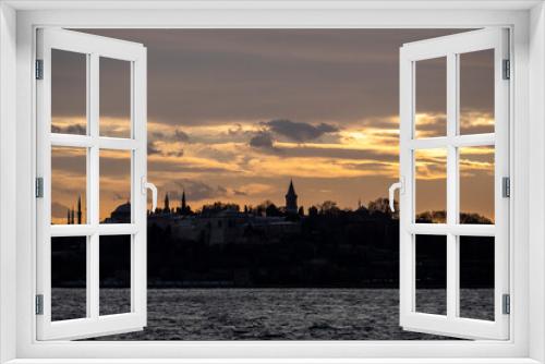 Fototapeta Naklejka Na Ścianę Okno 3D - During the sunset historical peninsula and Topkapi Palace in Istanbul, Turkey. This picture was taken from the sea.