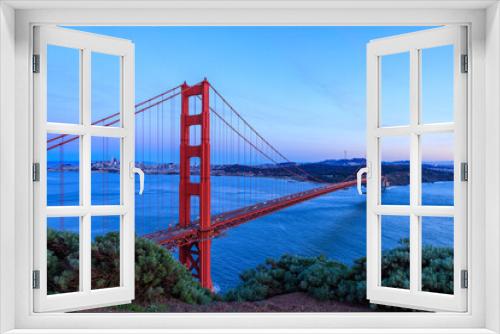 Fototapeta Naklejka Na Ścianę Okno 3D - Iconic Golden Gate Bridge and San Francisco city on coast at sunset