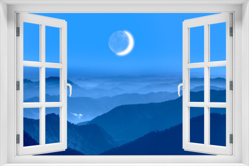 Fototapeta Naklejka Na Ścianę Okno 3D - Beautiful landscape with blue misty silhouettes of mountains Crescent moon in the background