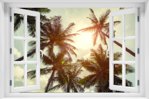 Fototapeta Naklejka Na Ścianę Okno 3D - Coconut palm trees on clody sky background. Low Angle View. Toned image.