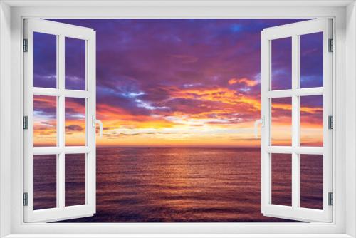 Fototapeta Naklejka Na Ścianę Okno 3D - view at sunrise or sunset in sea with nice beach , surf , calm water and beautiful clouds on a background of a sea landscape