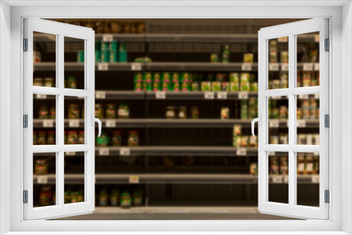 Half-empty shelves with canned food in the store. Panic and crisis. Blurred. Front view.
