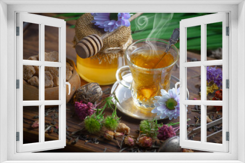Fototapeta Naklejka Na Ścianę Okno 3D - Sweet, hot tea with dry tea leaves, on an old background.