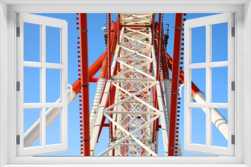 Fototapeta Naklejka Na Ścianę Okno 3D - Beautiful large Ferris wheel against blue sky, bottom view