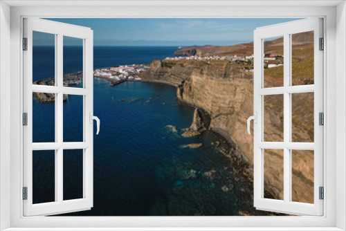 Fototapeta Naklejka Na Ścianę Okno 3D - Aerial view of beach and port in traditional whitewashed village, Puerto de las Nieves, Agaete, with cliffs in the northern coast of Gran Canaria, Spain