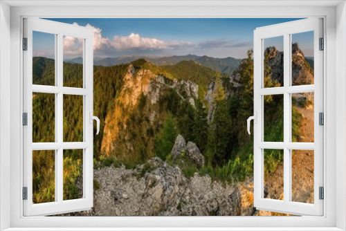 Fototapeta Naklejka Na Ścianę Okno 3D - Spring landscape with rocks and wrinkled hills with deep valleys. Natural wilderness untouched by human activity. Discover the spring beauty of the mountains.