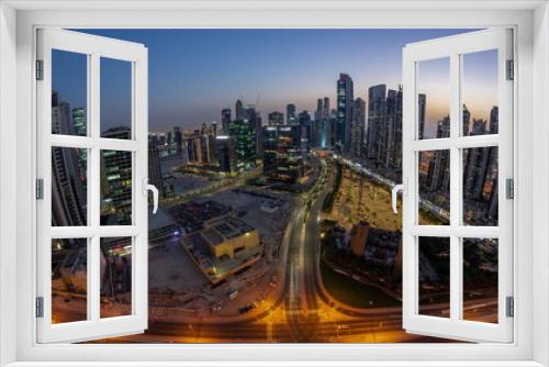 Fototapeta Naklejka Na Ścianę Okno 3D - Panoramic skyline of Bay Avenue with modern towers residential development in Business Bay aerial day to night timelapse, Dubai