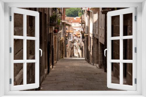 Fototapeta Naklejka Na Ścianę Okno 3D - The narrow and winding old streets of Galicia, Spain, lined with historic architecture and cobbled paths, offer a glimpse into the region's rich history and culture