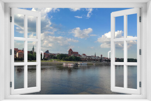 Fototapeta Naklejka Na Ścianę Okno 3D - panoramic view of Old City of Torun. Vistula (Wisla) river against the backdrop of the historical buildings of the medieval city of Torun. Poland.