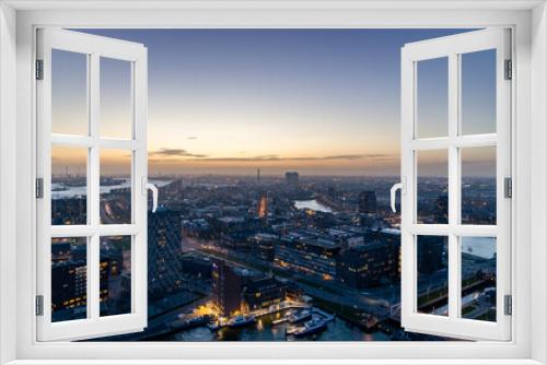 Start of Blue hour in Rotterdam, looking in the direction of the Port of Rotterdam