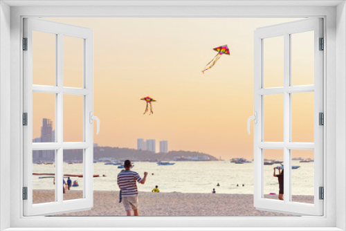 Fototapeta Naklejka Na Ścianę Okno 3D - People relaxing on sea coast, girl talking on phone, dad and daughter flying kite, selective focus.