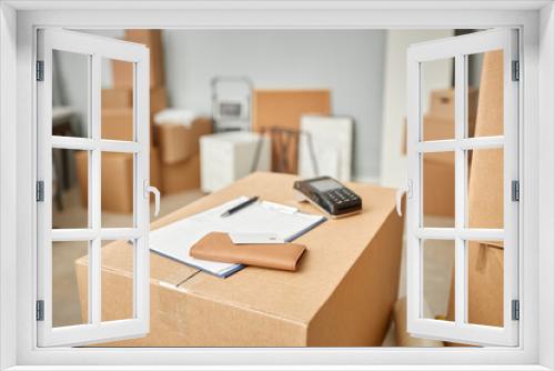 Selective focus of business contract of moving service with terminal on cardboard container