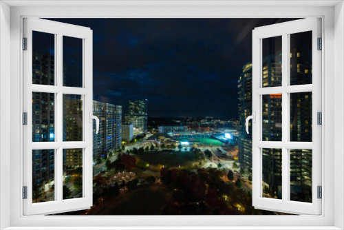 Fototapeta Naklejka Na Ścianę Okno 3D - Night View of Charlotte, North Carolina: A Spectacular Panorama of Plaza and Baseball Diamond