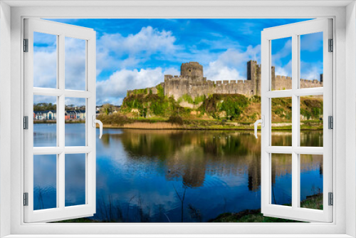 Fototapeta Naklejka Na Ścianę Okno 3D - A panorama view across the River Cleddau and the Norman castle at Pembroke, Wales on a bright day
