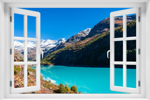 Fototapeta Naklejka Na Ścianę Okno 3D - Autumnal landscape of the Lake Place Moulin, an artificial glacial lake with turquoise water in the italian Alps,  on the border with Switzerland