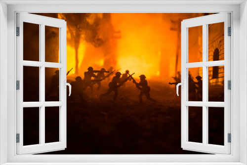 Fototapeta Naklejka Na Ścianę Okno 3D - War Concept. Battle scene on war fog sky background, Fighting silhouettes Below Cloudy Skyline at night. City destroyed by war