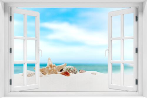 Fototapeta Naklejka Na Ścianę Okno 3D - Vacation, beach, travel, relaxation concept. Symbolic background with beach sand, different colorful shells, blue sky, clouds, sea or ocean on back. Minimalism. Copy space for business advertisement
