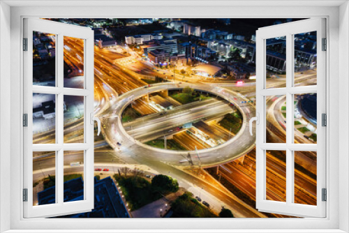 Fototapeta Naklejka Na Ścianę Okno 3D - A illuminated multilevel highway junction interchange during night time with blurred car traffic as seen in Athens, Greece