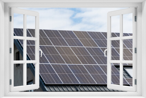 Fototapeta Naklejka Na Ścianę Okno 3D - New solar panels installed on metal sheet roof of the house