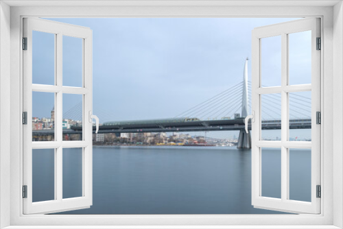 Fototapeta Naklejka Na Ścianę Okno 3D - Long exposure. View of Haliç Metro Bridge connecting Azapkapı (Beyoğlu) and Unkapanı (Fatih) (Halic Metro Bridge). blue sky Istanbul Turkey