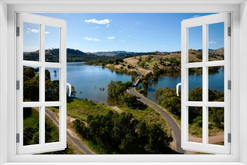 Fototapeta Naklejka Na Ścianę Okno 3D - Bird's eye view of a bridge on Lake Eildon surrounded by mountains in Victoria, Australia