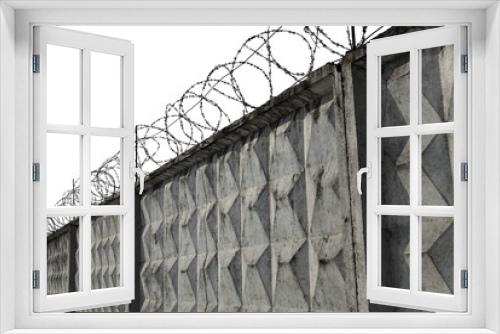 Fototapeta Naklejka Na Ścianę Okno 3D - Jail. Prison wall with barbed wire on a white background. Law