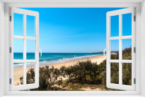 Fototapeta Naklejka Na Ścianę Okno 3D - Amazing wide panorama of Peregian Beach on a sunny day. Exotic beach background with blue turquoise water visible from the hill. Beautiful travel destination. Noosa, Sunshine Coast, Australia.