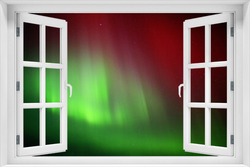 Fototapeta Naklejka Na Ścianę Okno 3D - Red and green aurora borealis on starry sky