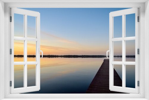 Fototapeta Naklejka Na Ścianę Okno 3D - Steg am See mit wundervollen Abendhimmel