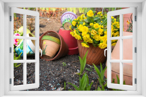Fototapeta Naklejka Na Ścianę Okno 3D - overturned flower pot, yellow flowers and seedlings on spring in the garden