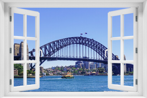 Fototapeta Naklejka Na Ścianę Okno 3D - The Sydney Harbor Bridge is a heritage-listed steel through arch bridge,  nicknamed The Coathanger because of its arch-based design and carries rail, vehicular, bicycle and pedestrian. Australia, 2017