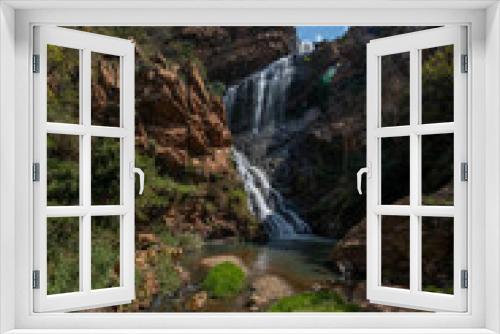 Fototapeta Naklejka Na Ścianę Okno 3D - Beautiful Waterfall at the Krugersdorp Botanical gardens. Beautiful nature with stunning water patterns and greenery showing the lush beauty as the water cascades