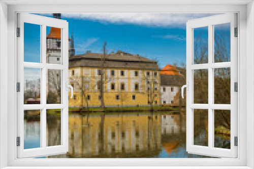 Nice castle with pond and forest in south Bohemia in spring day