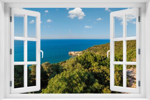 Fototapeta Naklejka Na Ścianę Okno 3D - Summer sea perched Peschici town and cape Trabucco di Monte Pucci view, Gargano peninsula in Puglia, Italy