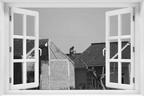Fototapeta Naklejka Na Ścianę Okno 3D - A worker on top