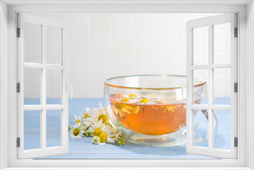 Fototapeta Naklejka Na Ścianę Okno 3D - Cup of medicinal chamomile tea