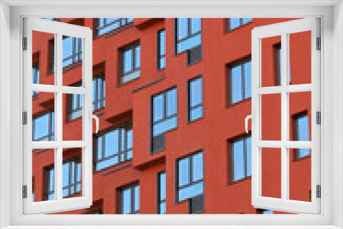 Fototapeta Naklejka Na Ścianę Okno 3D - Fragment of the facade of an apartment building on a spring day