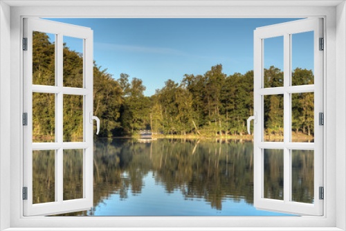 Fototapeta Naklejka Na Ścianę Okno 3D - A small bridge crosses a narrow point of a Swedish lake