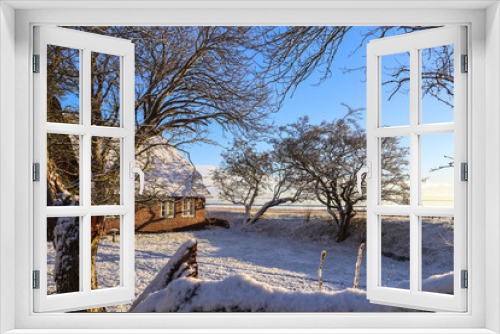 Fototapeta Naklejka Na Ścianę Okno 3D - Snow Landscape on the island Sylt in Keitum, Germany