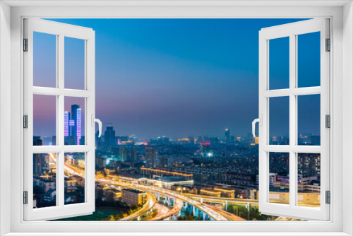 Fototapeta Naklejka Na Ścianę Okno 3D - Night view of Saihong Bridge and city skyline in Nanjing, Jiangsu, China