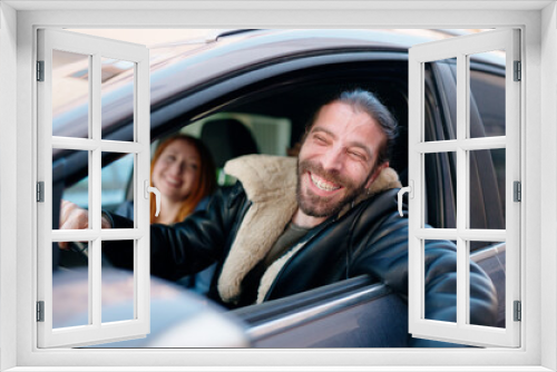 Man and woman couple smiling confident driving car at street