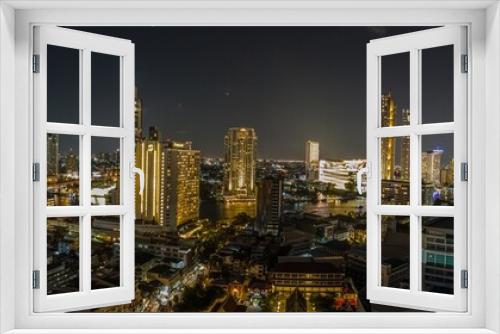 Fototapeta Naklejka Na Ścianę Okno 3D - View over the skyline of Bangkok from aerial position at night