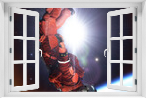 Fototapeta Naklejka Na Ścianę Okno 3D - Flight of astronaut cosmonaut in space. Cosmic weightlessness, gravity, falling man into galactic abyss of planet. Astronaut in zero gravity, stars and nebulae. 3d render