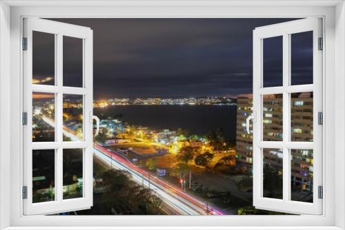 Fototapeta Naklejka Na Ścianę Okno 3D - Long exposure shot of the traffic light of the illuminated Matanzas in Cuba at night