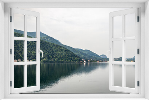 Fototapeta Naklejka Na Ścianę Okno 3D - Morcote, Ticino, Switzerland - May 21, 2022 View of Lake Lugano from  Morcote